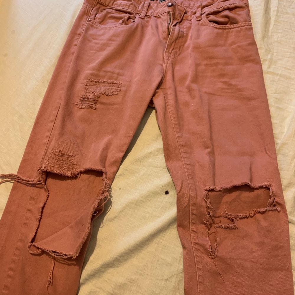 Pink ripped jeans